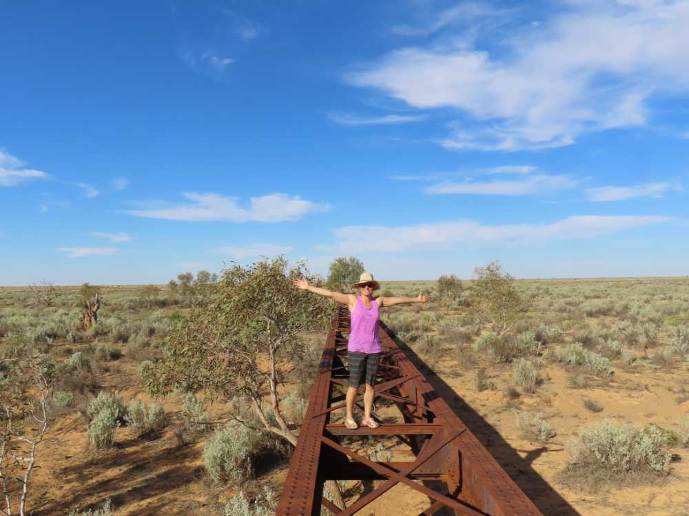 Jude on top of an old bridge from the Ghan railway line