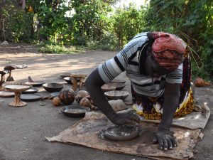 making a clay dish, the Ari people are known for creating the plates to make injera