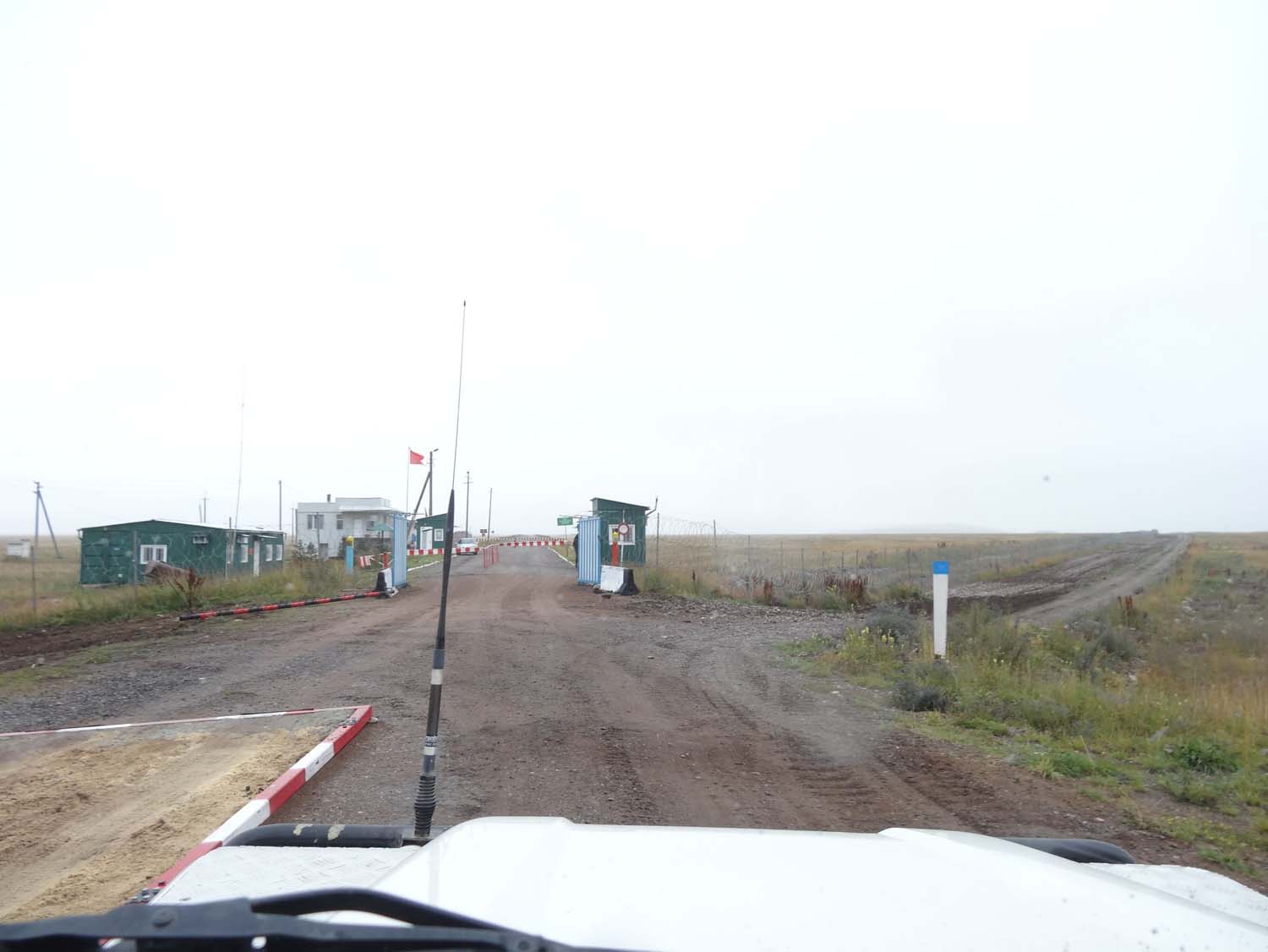 you can just see the sandpit where cars have to drive through going into Kazakhstan. This is the view of the Kyrgyz side of the border post