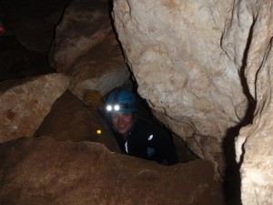 Jude coming out of a tiny hole in Dingo Cave