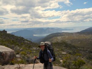 Jon with Wineglass Bay in the distance - that is where we are walking to today