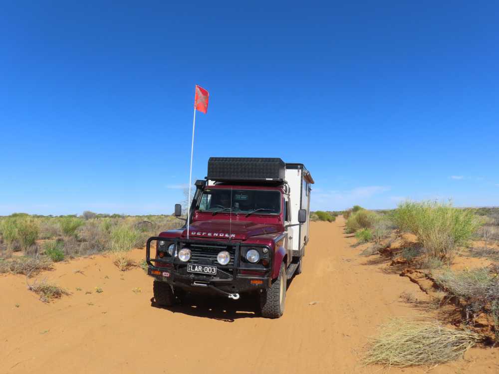 Lara with her sand flag in the Simpson Desert