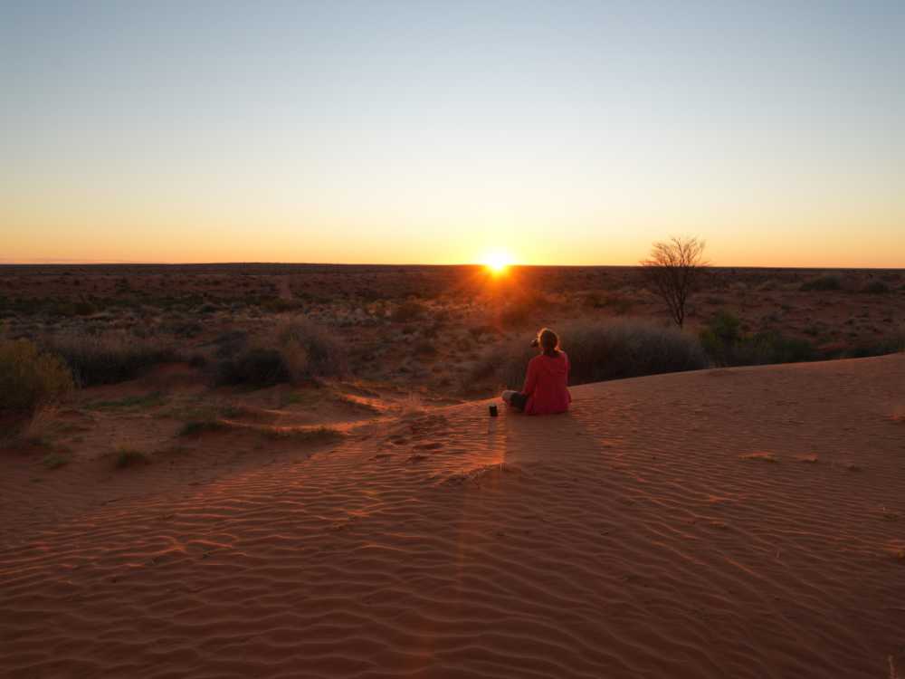 we enjoy sundowners on our own private sand dune next to our campsite