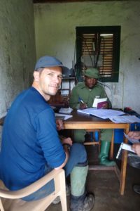 Jon registering our permit to hike up active volcano Nyiragongo