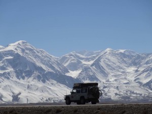 Lara with an impressive back drop of the Pamir Mountains of Tajikistan. Here we are still on the high plateau of Kyrgyzstan.