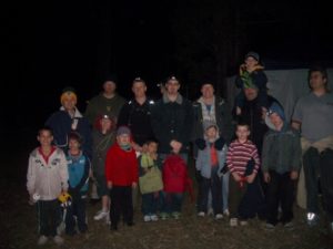 a huge group of fathers and sons enjoying a bonding weekend