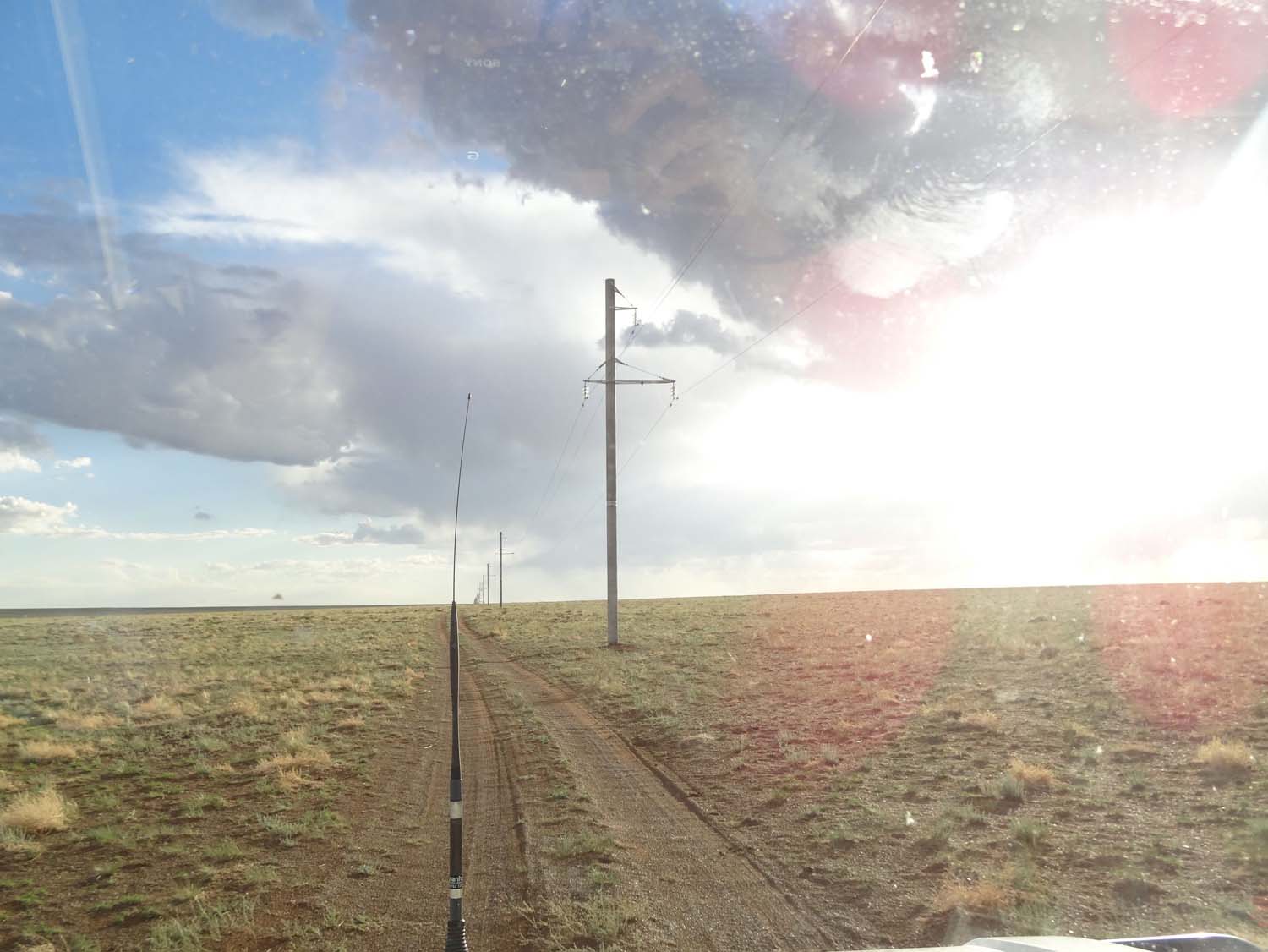 following the tracks next to the telegraph lines in the Gobi