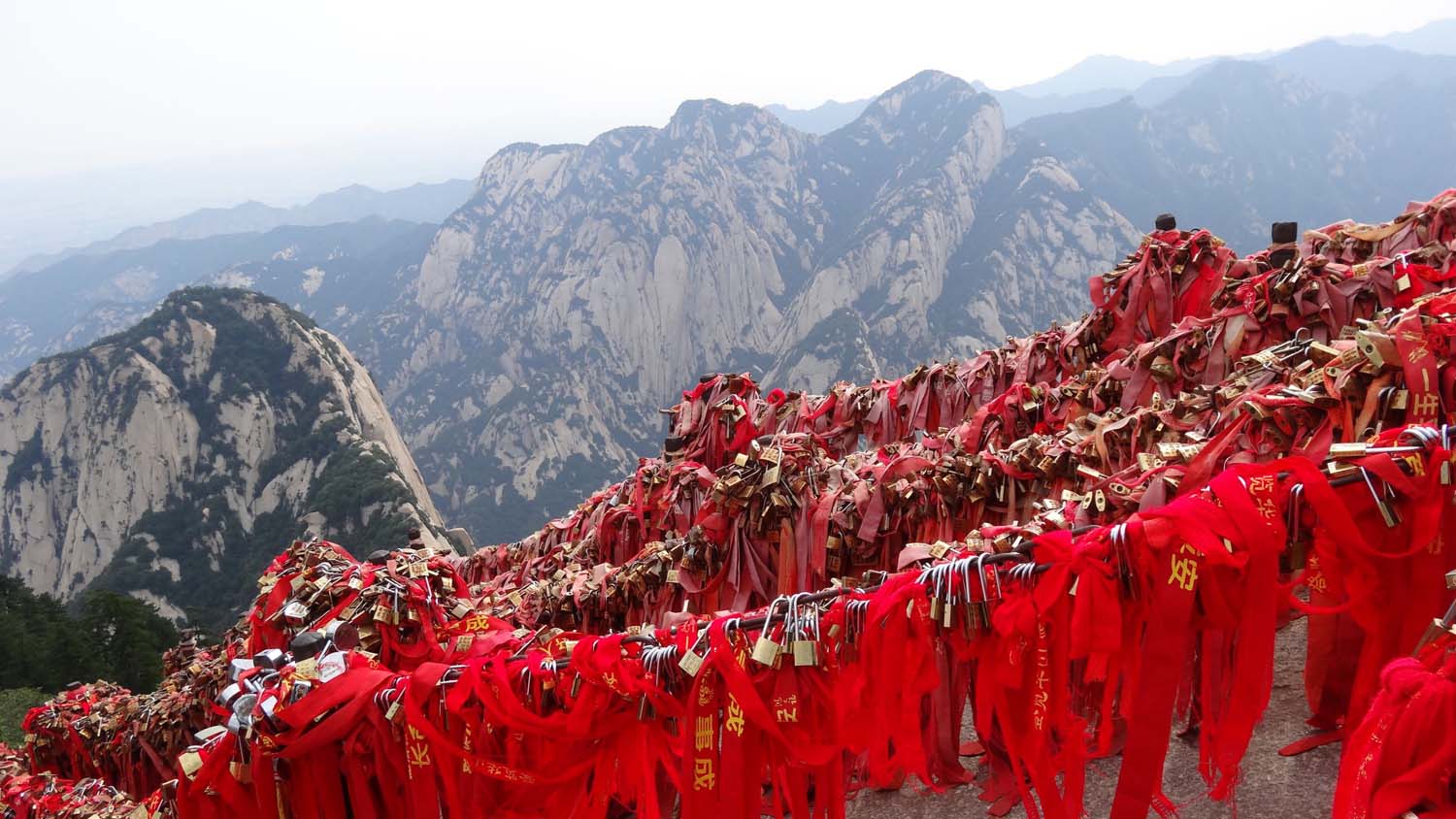 lots of couples leave a padlock with their names engraved in it on the mountain, often together with a red piece of cloth for good luck