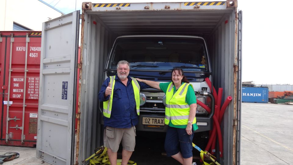 Rob & Robyn with their truck in the container