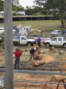 Boonah show - after the chainsaw they hammer in the metal wedges and split the wood into posts