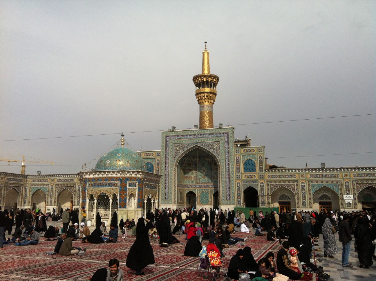 many pilgrims visit the holiest shrine in Mashhad each year