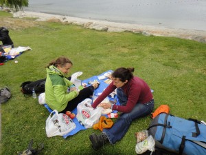 packing our food into our packs at the shores of Lake Wanaka