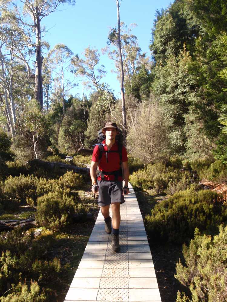 Jon hiking on the boardwalks towards Narcissus Hut