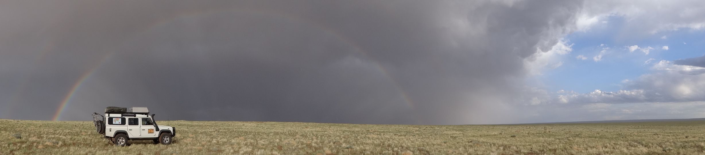 Lara and rainbow in the Gobi Desert
