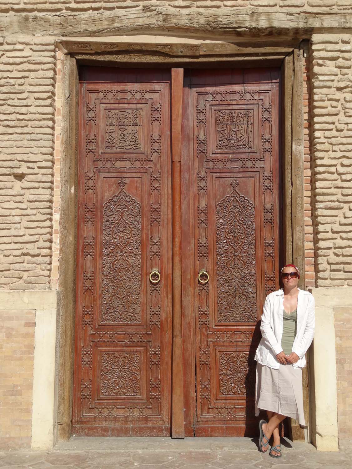 covering up for the first time to visit the mausoleum - beautiful carved doors