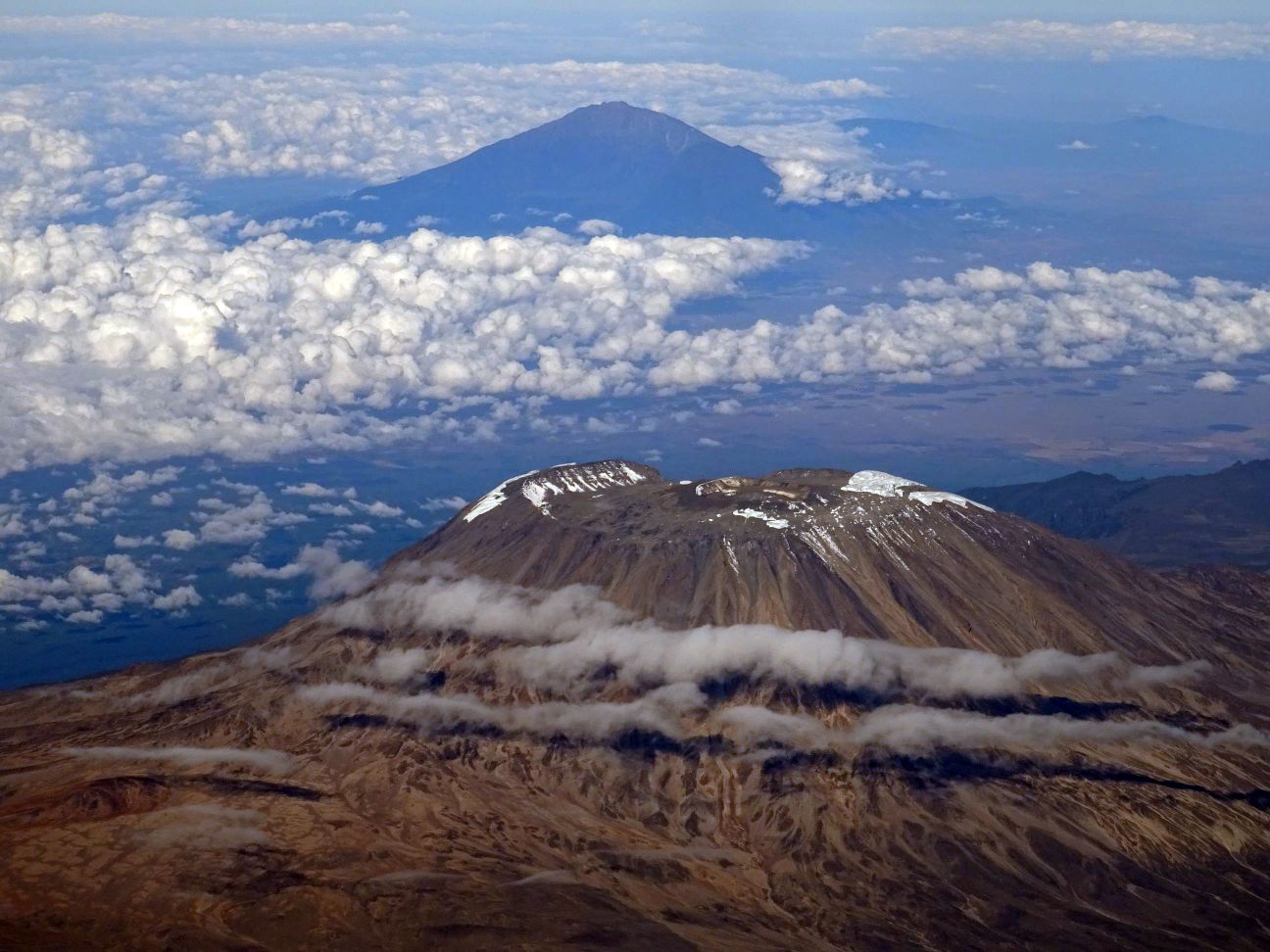 Mt Kilimanjaro in the foreground, Mt Meru in the background - stunning views from our flight over to Dar