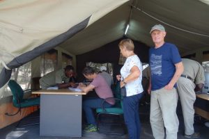 Jon filling in the paperwork at Tarangire NP with Nico and Riet waiting