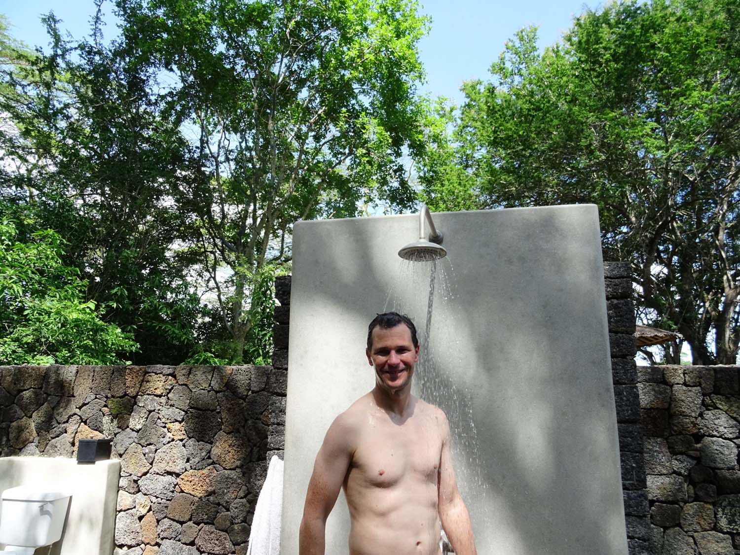 our outdoor shower, and yes, that is an outdoor toilet in the left corner!