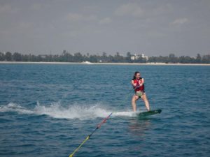 Jude wakeboarding on a kitesurfing board
