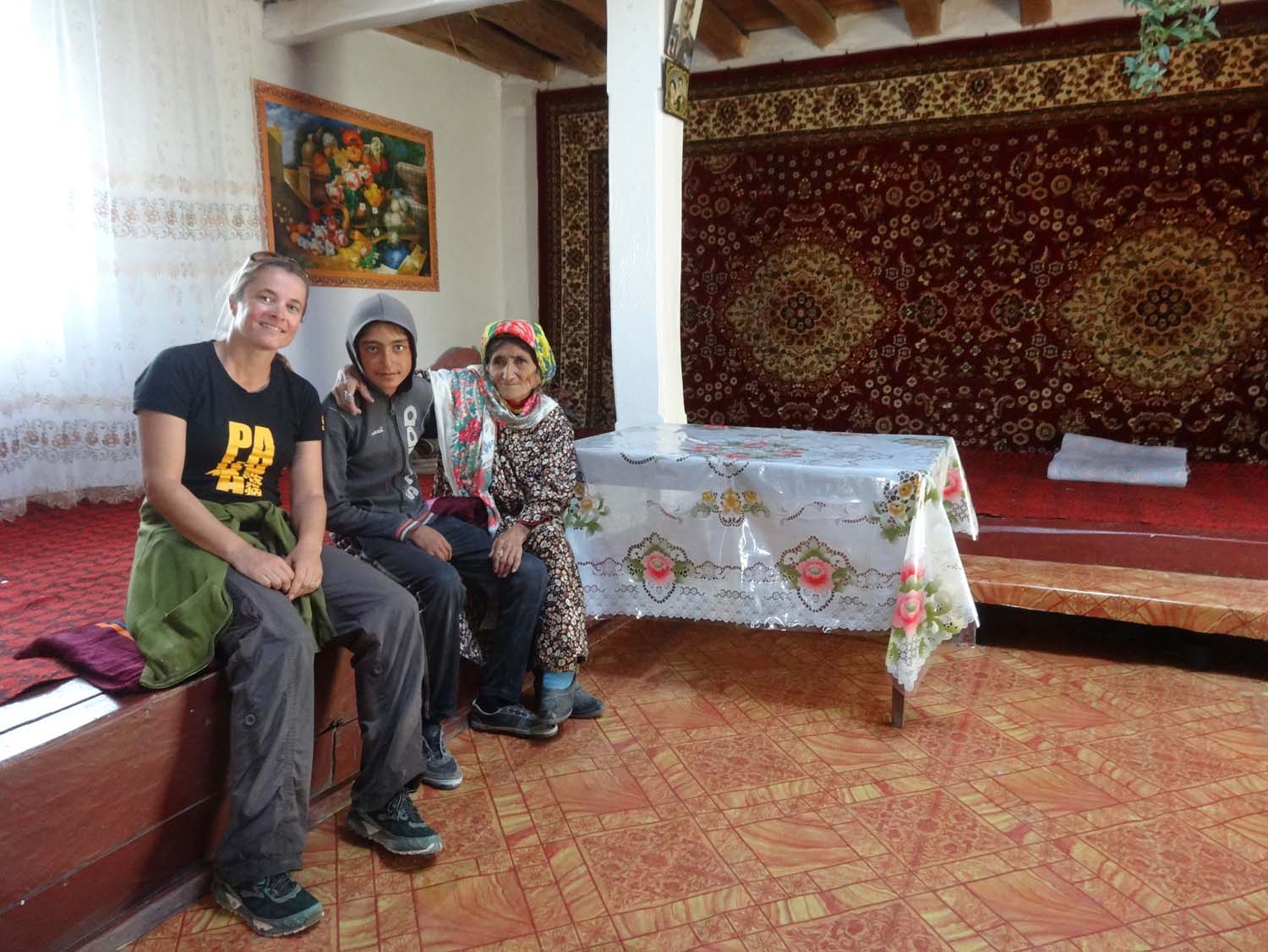 inside a large traditional Pamir home with Ruslan and his grandmother