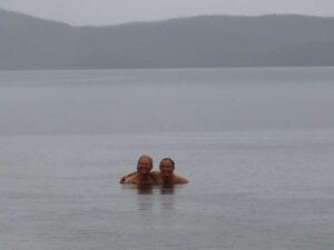Karen and Jude go for a swim in the rain in Lake Adelaide